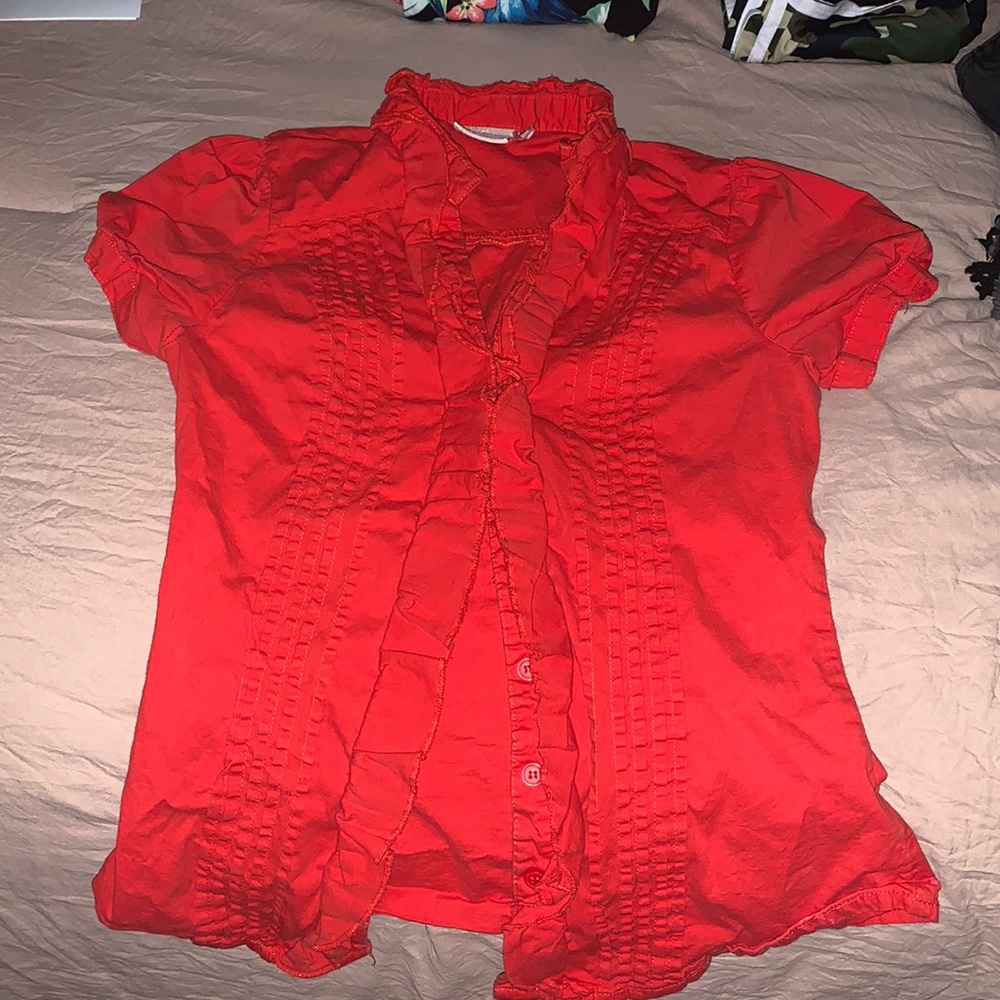 Cherry red sleeveless business shirt.